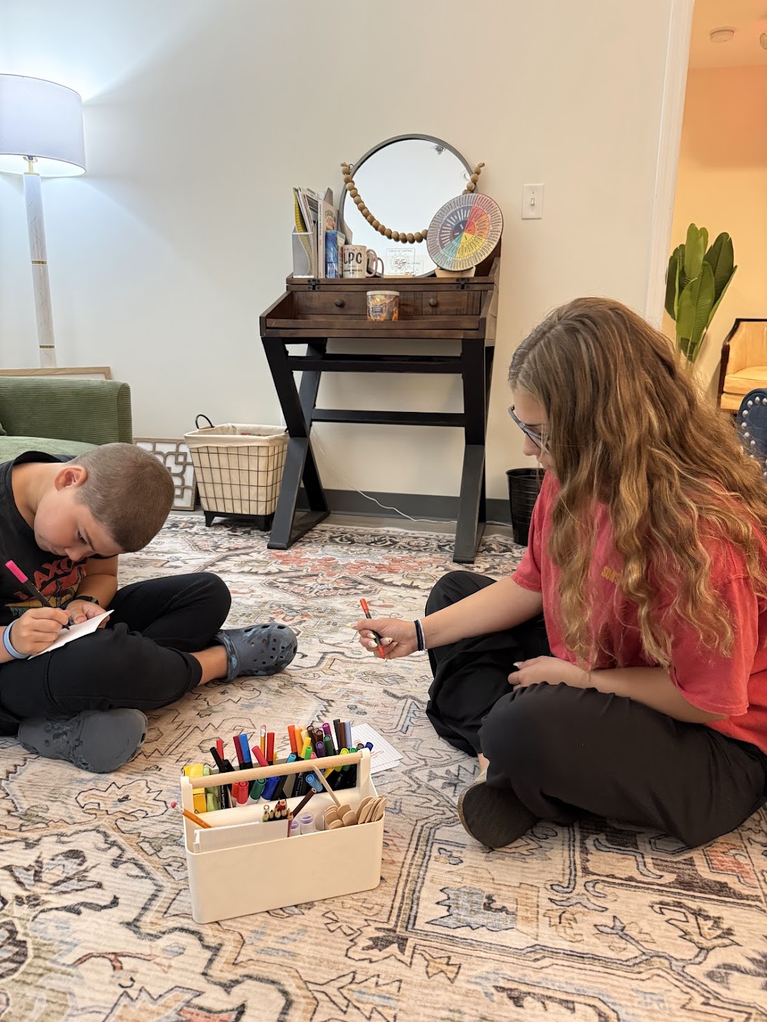 Play and art therapy materials spread out during a session