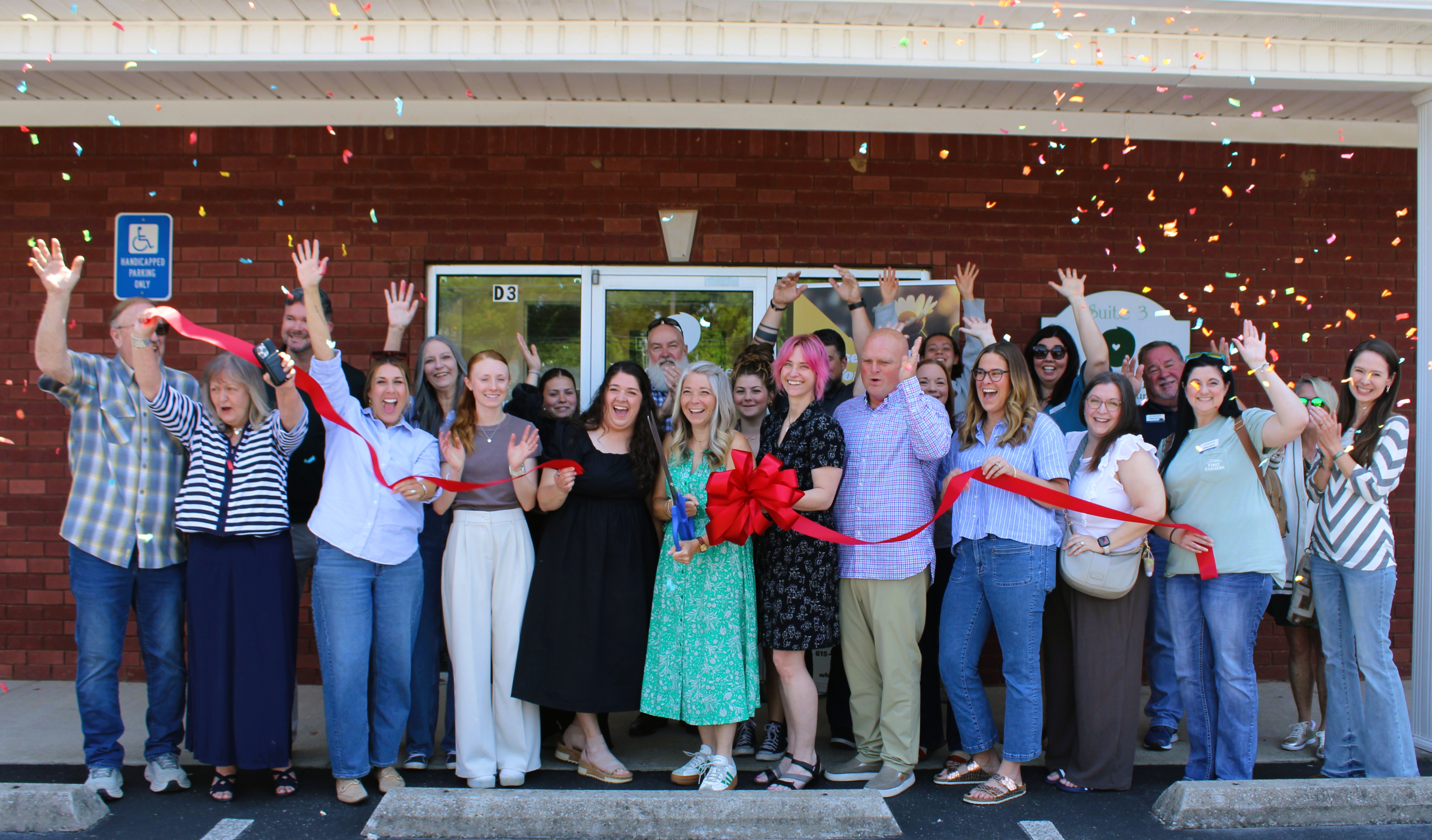 Wholehearted Counseling team and community celebrating the ribbon cutting